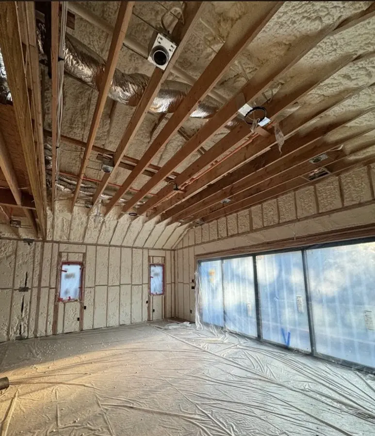 Interior walls and ceiling insulated with spray foam during new construction in Phelps